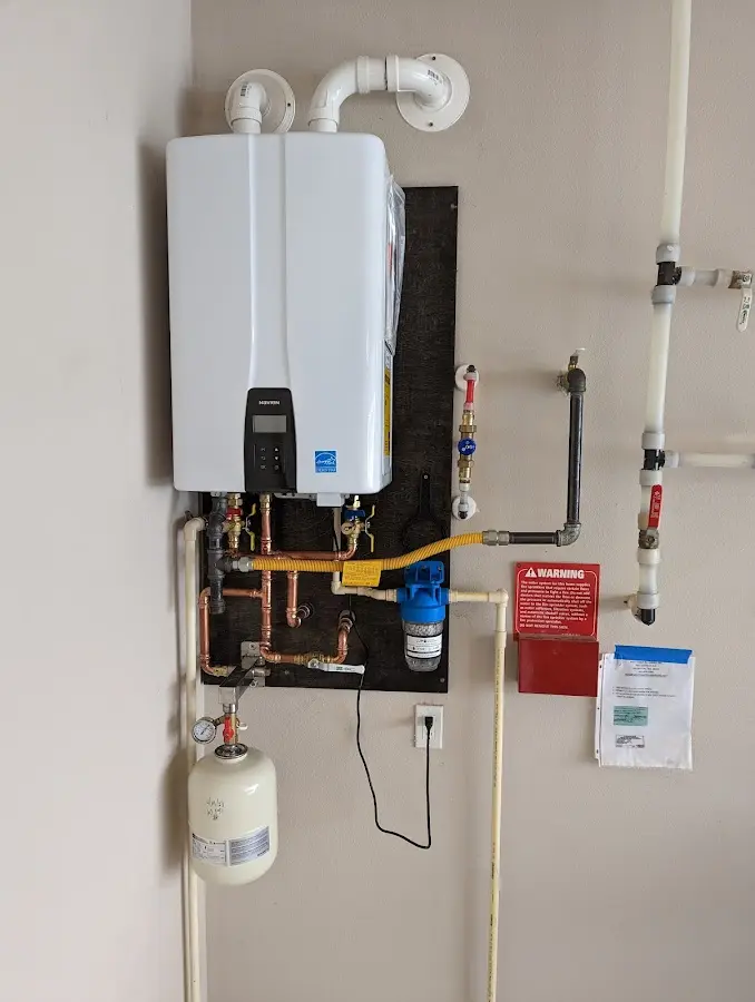 Professional plumber installing copper piping in a Sunnyslope home